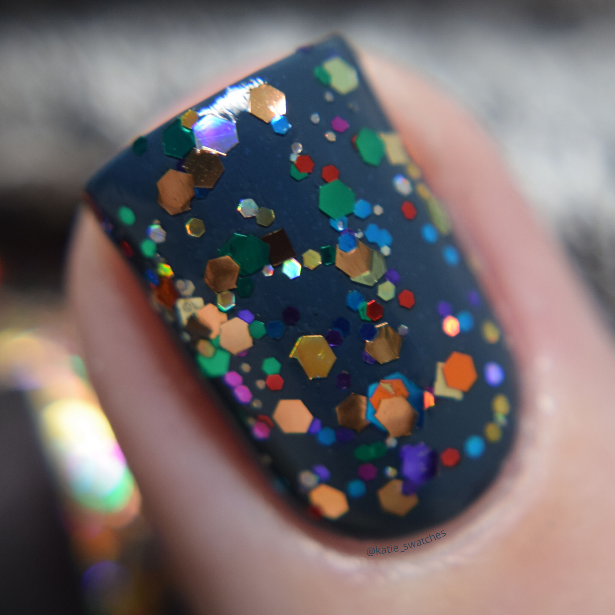 CrowsToes Nail Color Thing colorful glitter topper nail polish swatch indie nail polish layered over Catrice Hip Queens Wear Blue Jeans blue creme nail polish