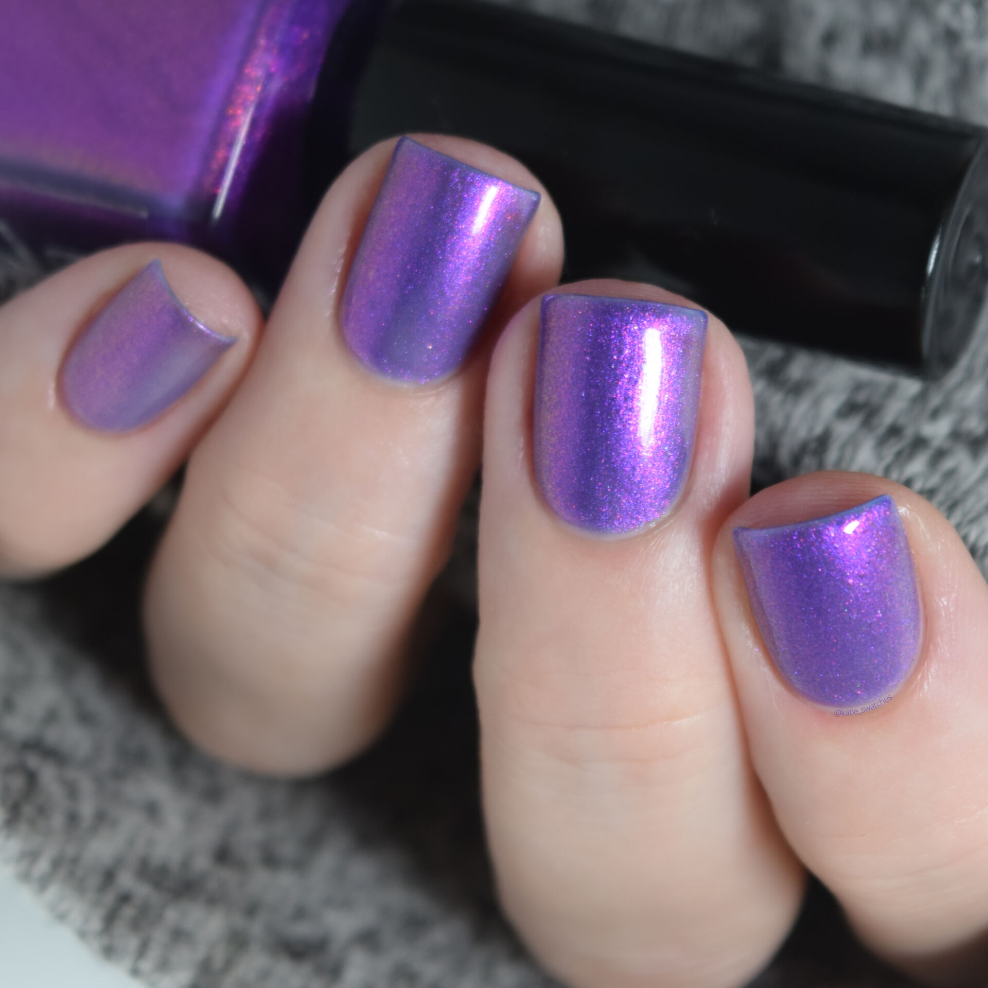 Bedford and Grove - Seven! Seven! Seven! nail polish swatch. A deep violet based nail polish and is packed with pink and purple aurora shimmer.