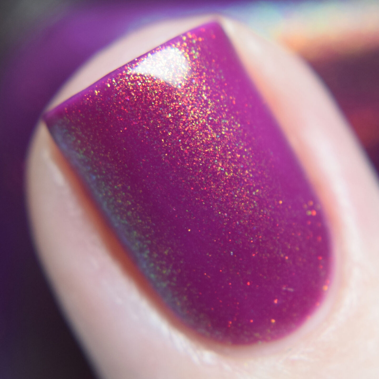Lemming Lacquer She Was a Rainbow is a purple leaning magenta jelly packed with shimmer shifting gold to copper to green to blue. Nail polish swatch Polish Pickup PPU Exclusive