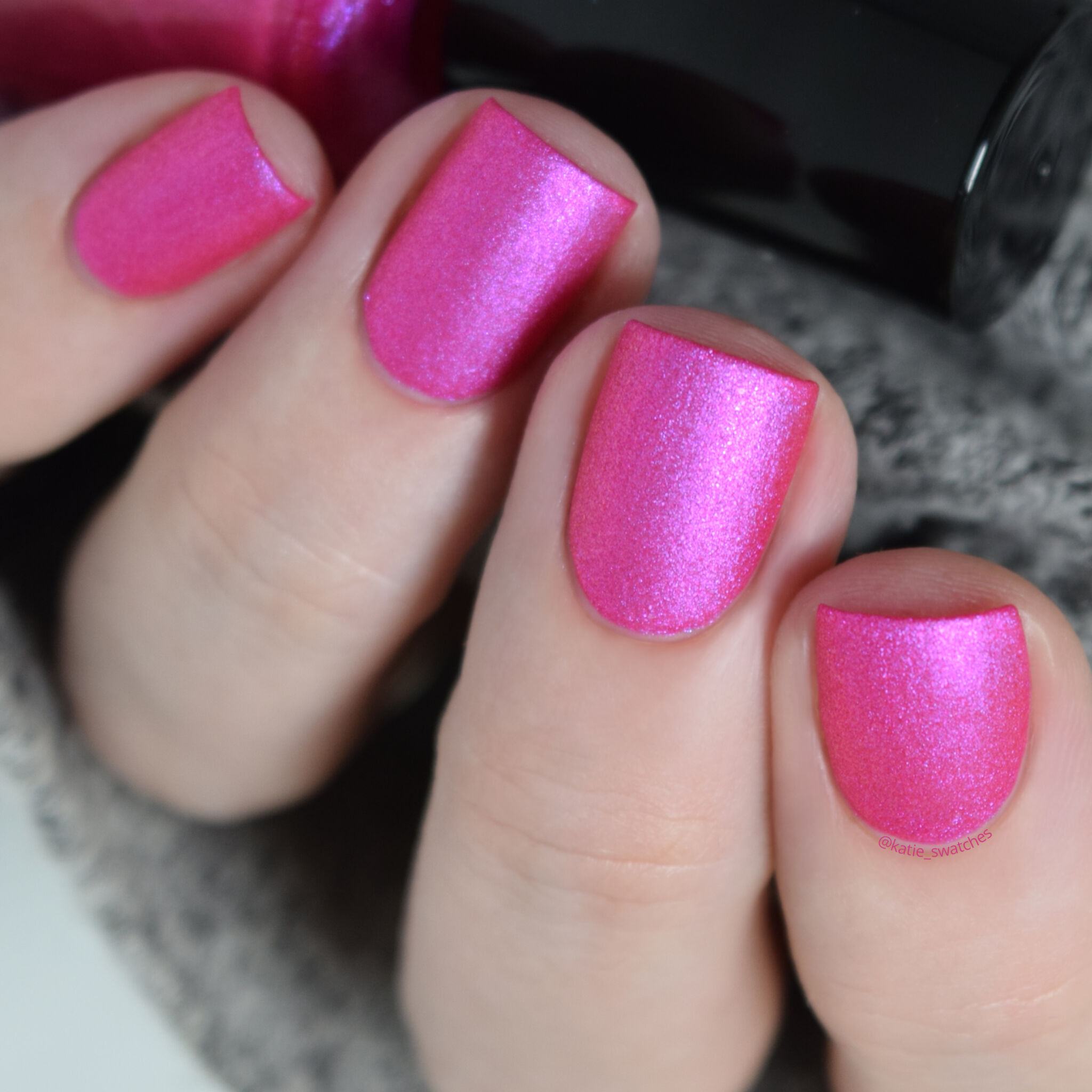 Girly Bits - Electric Boobs nail polish swatch. Fuchsia pink matte nail polish with a pink/purple shimmer.