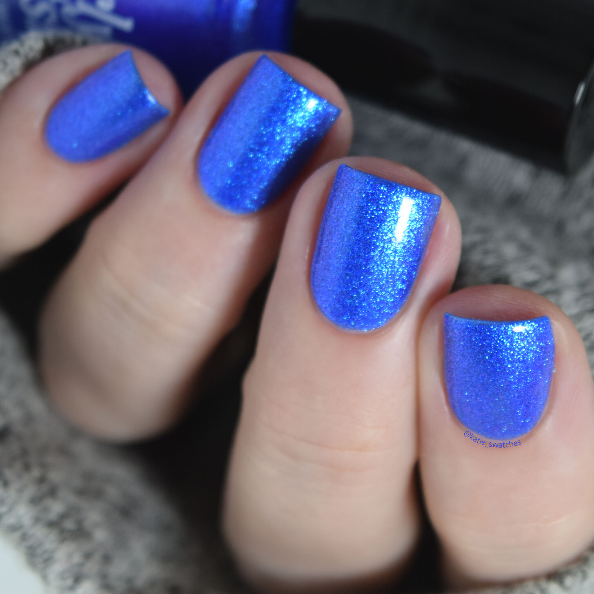 Girly Bits - Hot Dogs nail polish swatch with top coat. Ultramarine blue matte nail polish with a violet/blue shimmer.