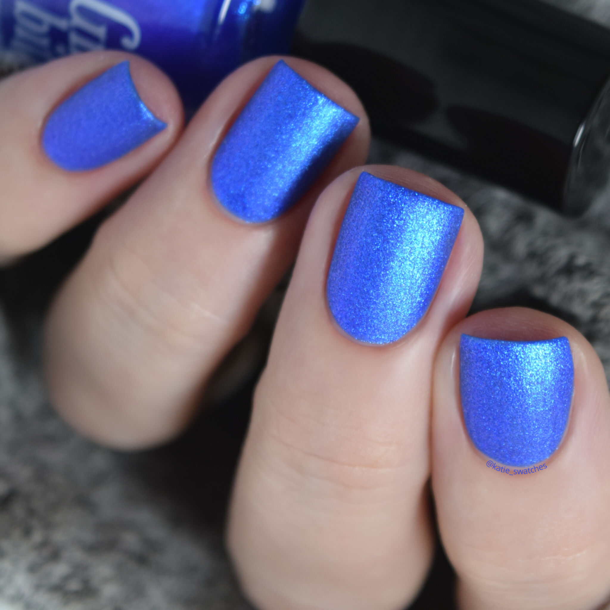 Girly Bits - Hot Dogs nail polish swatch. Ultramarine blue matte nail polish with a violet/blue shimmer.