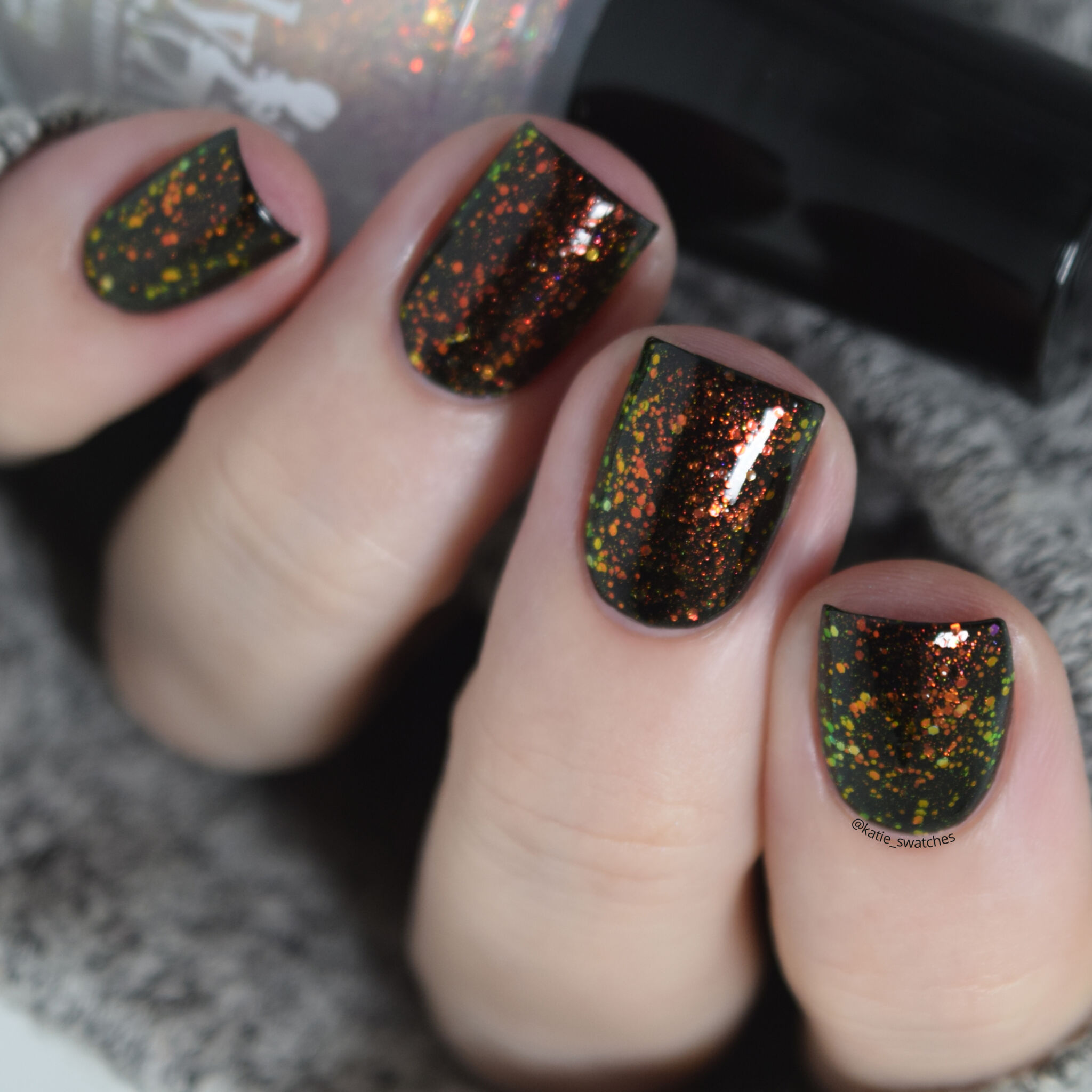 Girly Bits - Tony Danza iridescent colour shifting glitter nail polish topper layered over Girly Bits Little Black Dress (black creme nail polish)