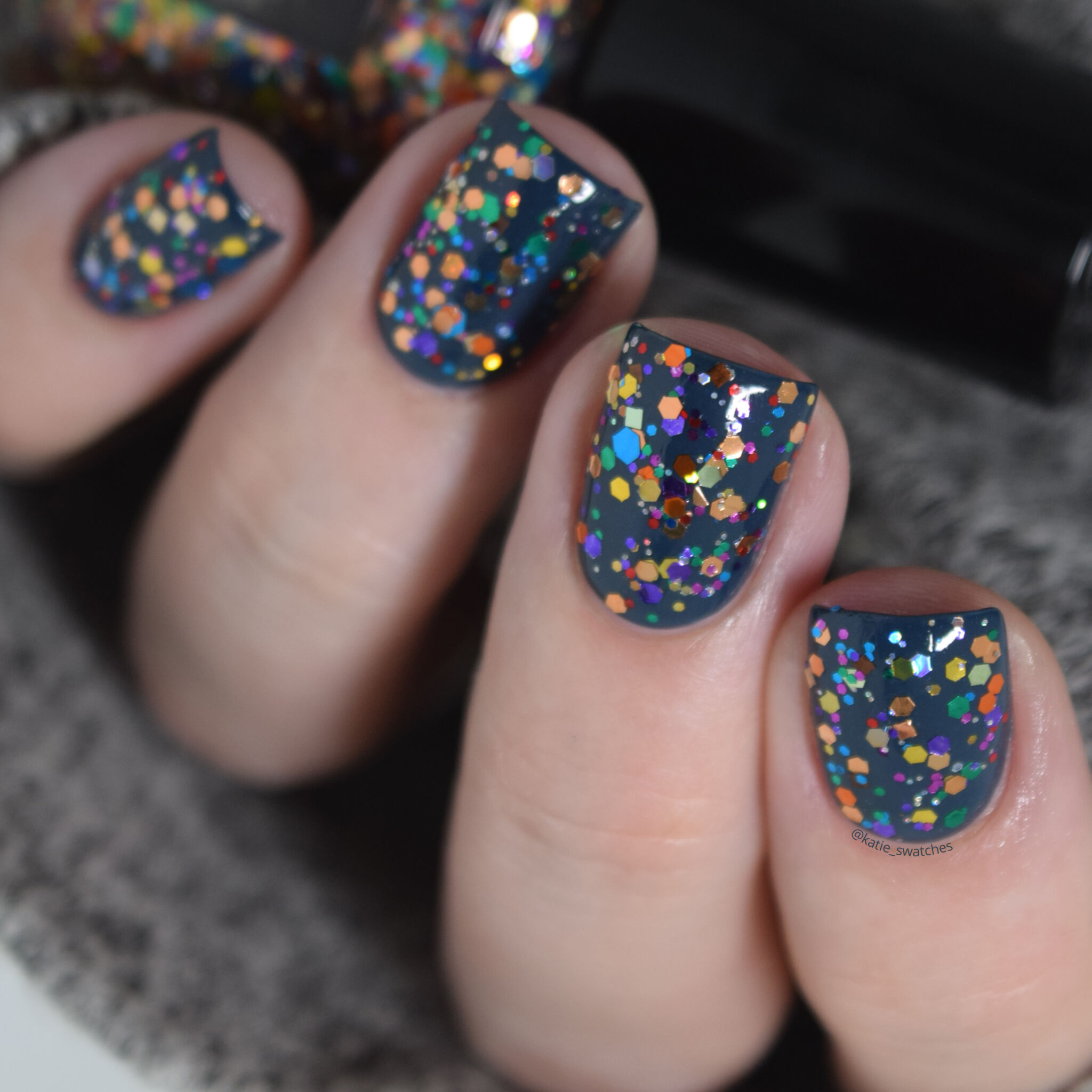 CrowsToes Nail Color Thing colorful glitter topper nail polish swatch indie nail polish layered over Catrice Hip Queens Wear Blue Jeans blue creme nail polish